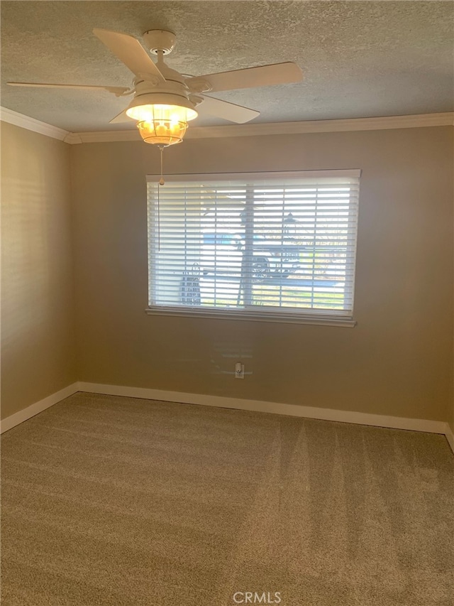 unfurnished room with carpet floors, crown molding, a textured ceiling, and a ceiling fan