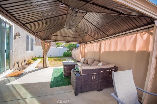 view of patio with an outdoor living space and a gazebo