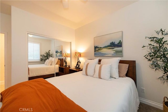 bedroom featuring ceiling fan and a closet