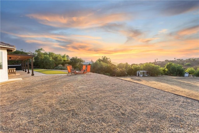 view of yard at dusk