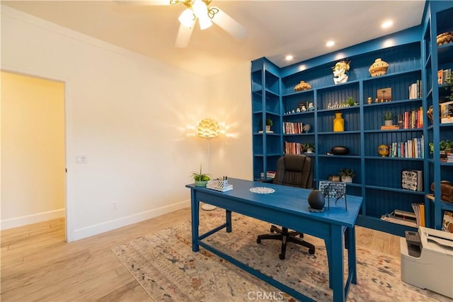 home office with wood-type flooring, ceiling fan, and ornamental molding