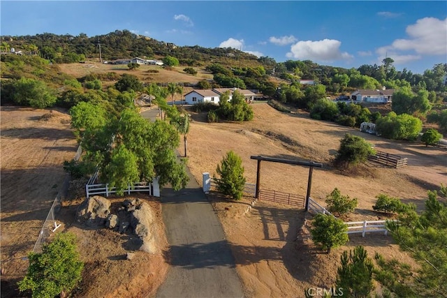 birds eye view of property with a rural view