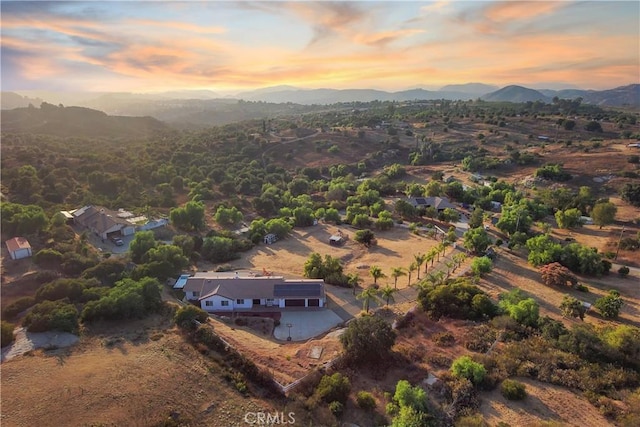 aerial view at dusk with a mountain view