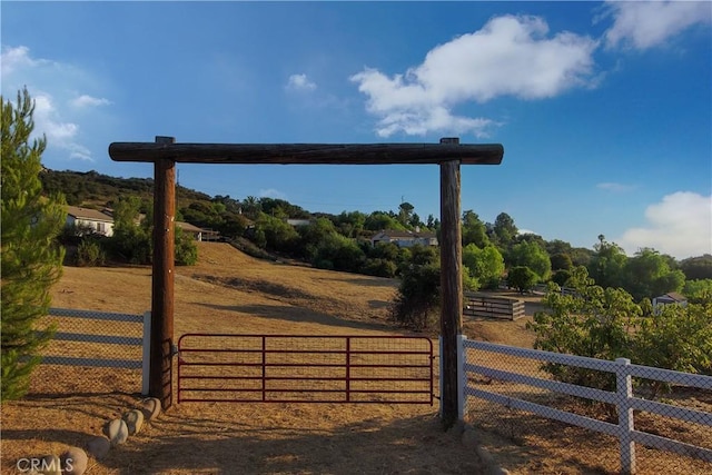 view of gate featuring a rural view