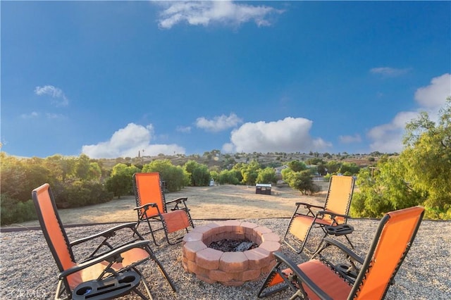 view of patio with an outdoor fire pit