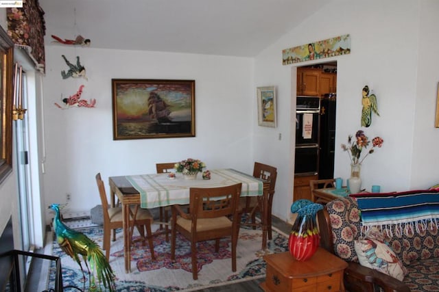 dining area with lofted ceiling