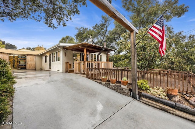 view of front of house with a patio area