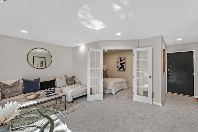 carpeted living room featuring french doors