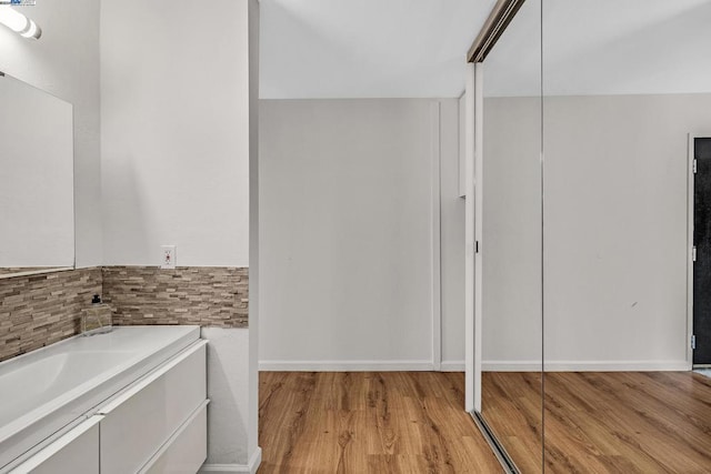 bathroom featuring wood-type flooring