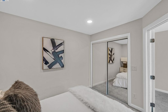 bedroom featuring carpet floors and a closet