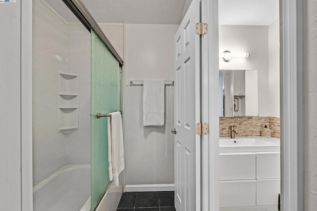 bathroom featuring tile patterned flooring, vanity, and an enclosed shower