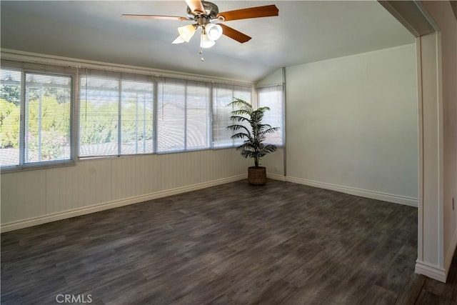 spare room featuring dark hardwood / wood-style flooring, ceiling fan, and lofted ceiling