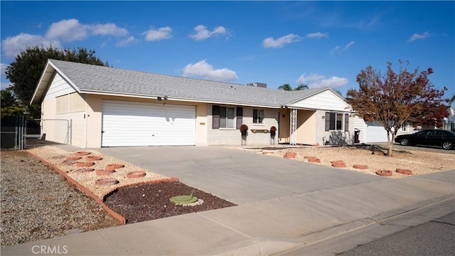 ranch-style house featuring a garage