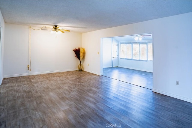 unfurnished room with dark hardwood / wood-style floors, ceiling fan, and a textured ceiling