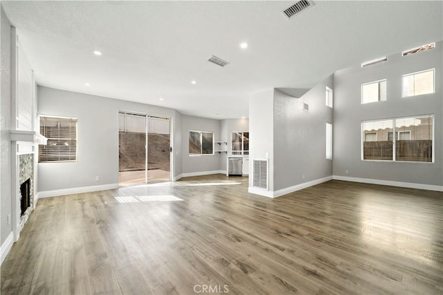 unfurnished living room with hardwood / wood-style flooring