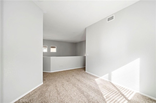 spare room with light carpet