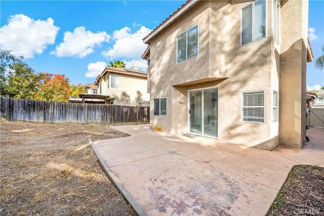 back of house featuring a patio