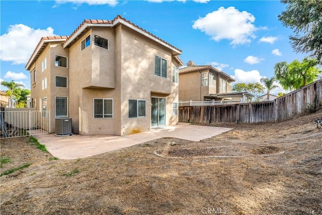 rear view of house featuring a patio area and central AC unit