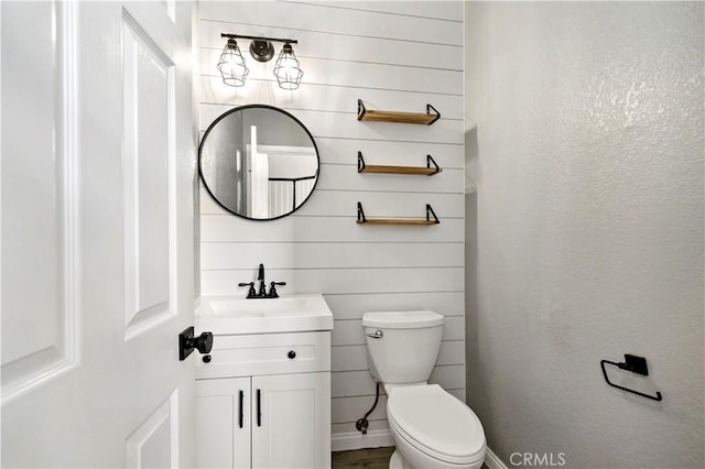 bathroom with toilet and vanity