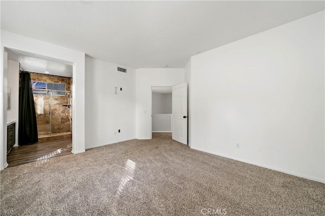 empty room featuring carpet flooring