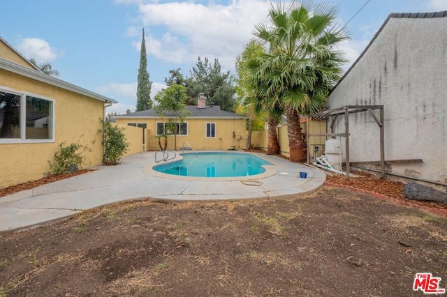 view of pool featuring a pergola and a patio