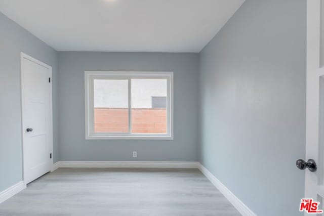 unfurnished room featuring light wood-type flooring