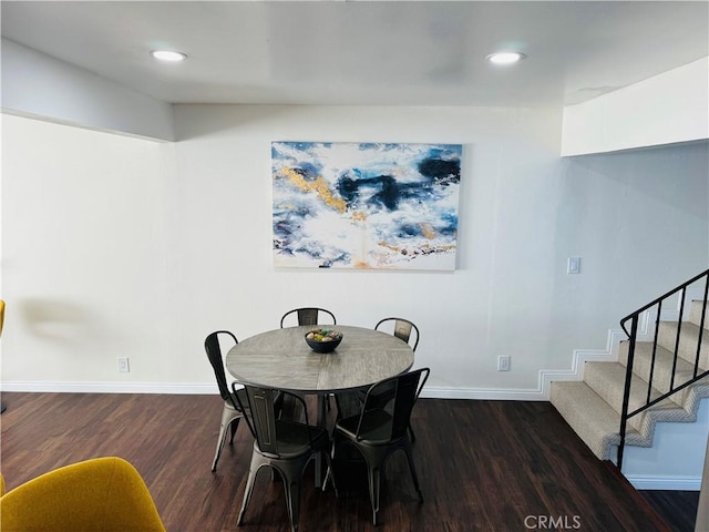 dining room with dark wood-type flooring