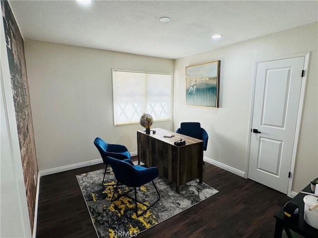 office space featuring dark hardwood / wood-style floors and a textured ceiling