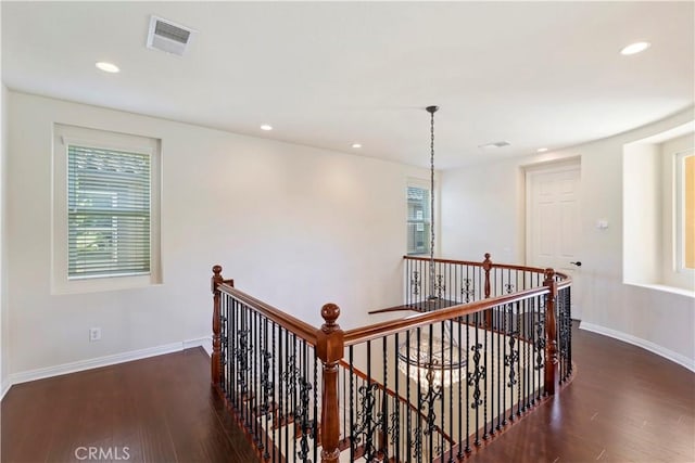 hallway featuring dark hardwood / wood-style flooring