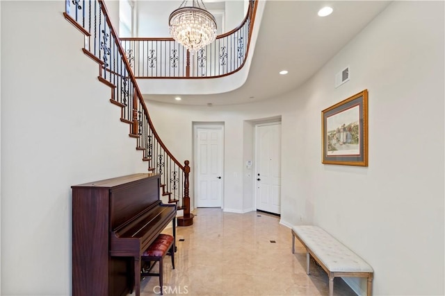 foyer entrance featuring a chandelier