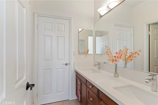 bathroom with vanity and tile patterned floors