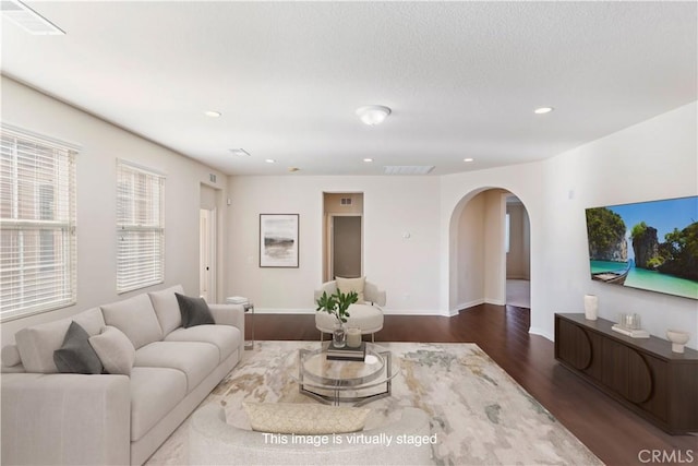 living room featuring dark hardwood / wood-style flooring