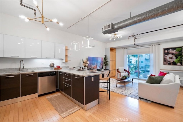 kitchen with white cabinetry, dishwasher, pendant lighting, and dark brown cabinetry