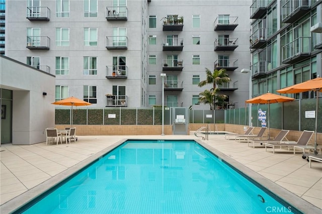 view of swimming pool with a patio