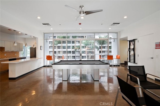 rec room featuring pool table, a wall of windows, and plenty of natural light