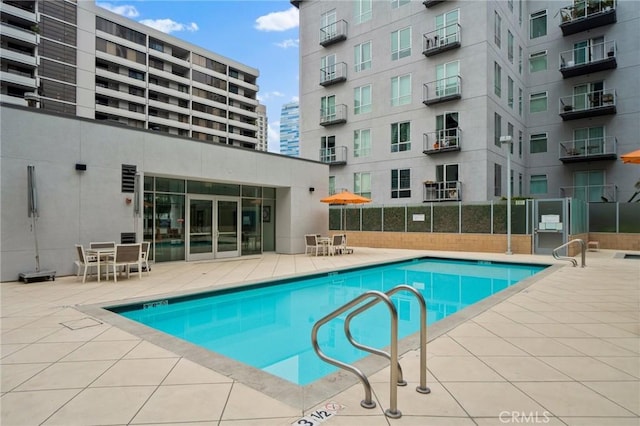 view of swimming pool with a patio