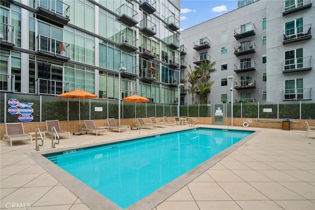 view of swimming pool featuring a patio area