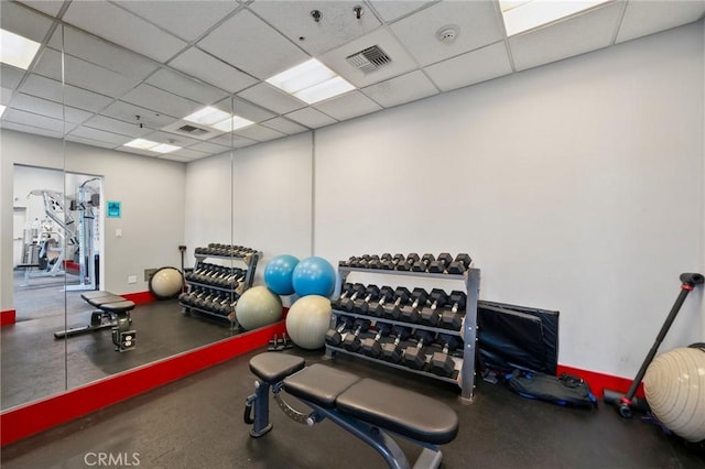 exercise room featuring a paneled ceiling