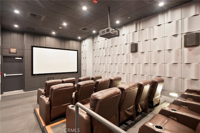 cinema room featuring a drop ceiling