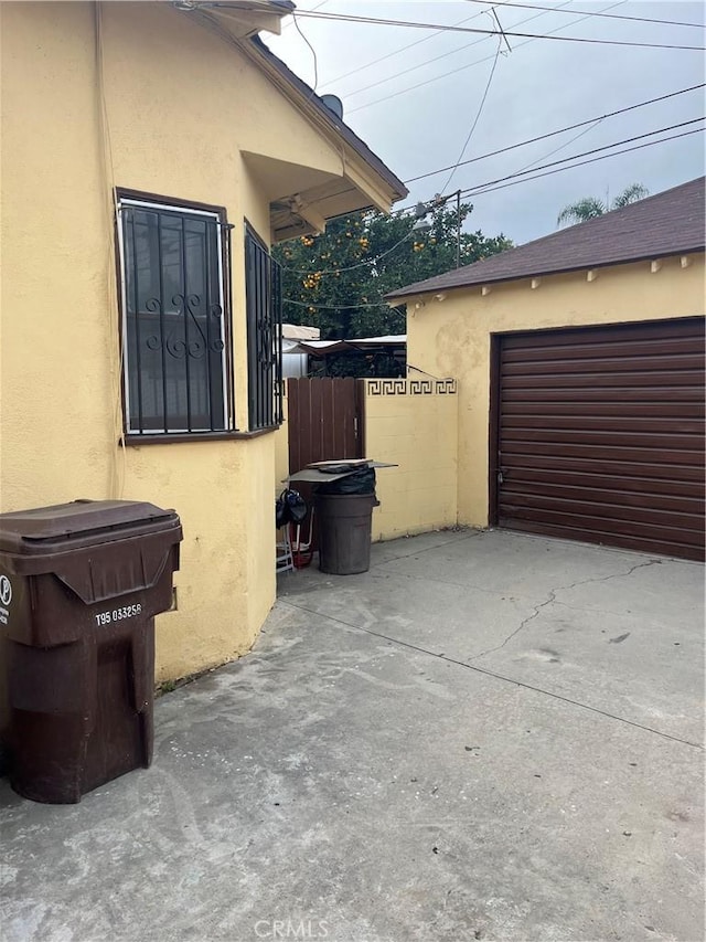 view of property exterior with a patio area