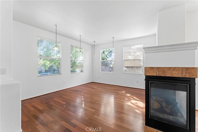 unfurnished living room featuring wood-type flooring