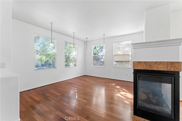 11465 Oakford Ln, Porter Ranch, CA 91326 - unfurnished living room featuring wood finished floors and a fireplace
