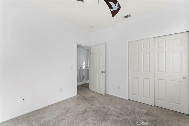 11465 Oakford Ln, Porter Ranch, CA 91326 - unfurnished bedroom with carpet flooring, a closet, and a ceiling fan