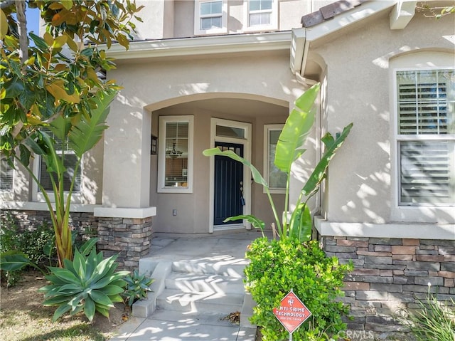 11465 Oakford Ln, Porter Ranch, CA 91326 - property entrance with stone siding and stucco siding