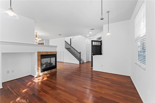 11465 Oakford Ln, Porter Ranch, CA 91326 - unfurnished living room featuring wood finished floors, a fireplace, stairway, a chandelier, and recessed lighting