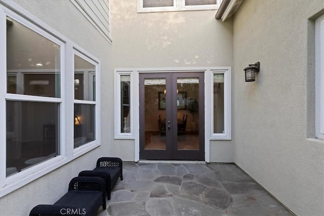 property entrance featuring french doors and a patio