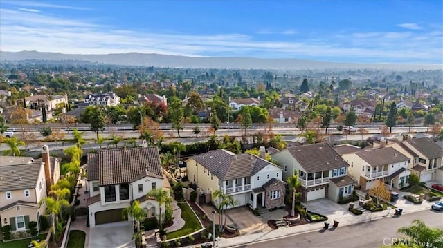 birds eye view of property featuring a mountain view