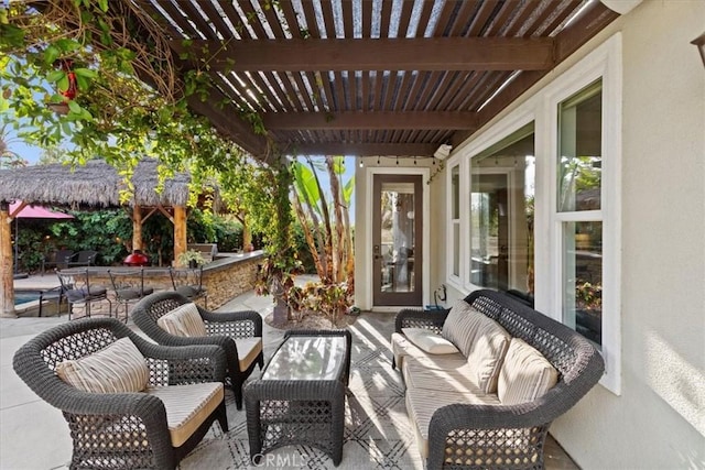 view of patio featuring an outdoor living space and a pergola