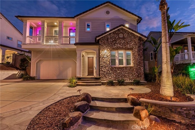 view of front of house with a balcony and a garage