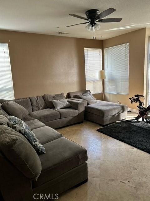 living room featuring ceiling fan